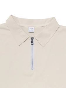 Detail of beige quarter-zip polo neck collar with polished metal zipper and M size label