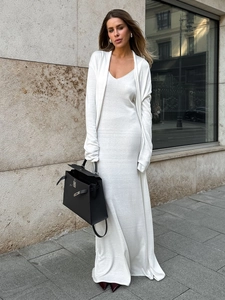 Detailed view of white knitted V-neck maxi dress with matching long-sleeve cardigan set