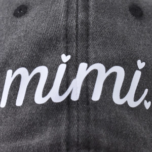 Washed dark grey baseball cap with embroidered mimi letters and small heart details