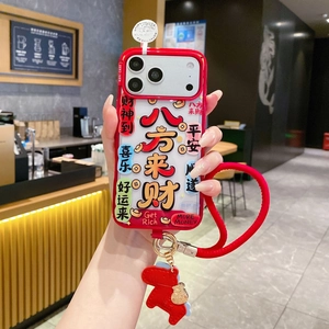 Macro detail of red iPhone case with Chinese luck charms and thick lanyards accessory