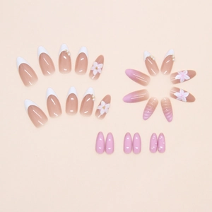 Detailed flat lay of 3D floral pearl gradient press-on nails in almond shape