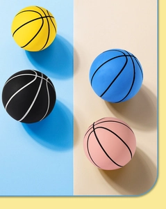 Detailed close-up of four colorful mini rubber basketballs showing anti-slip texture