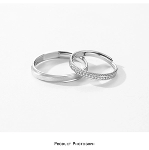 Close-up of S925 sterling silver brushed ring and diamond pavé band for couples