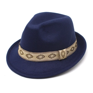 Detailed view of dark blue wool fedora featuring a patterned jacquard ribbon band