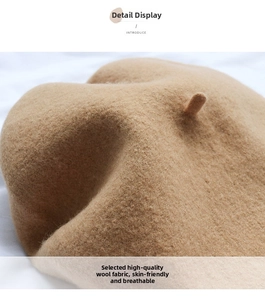 Detailed macro view of camel wool beret fabric showing soft texture and fine knitting