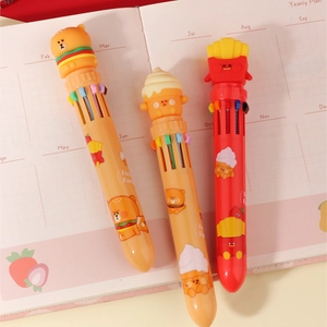 Close-up of 10-color shuttle pens with cute burger and fries food family cartoon toppers