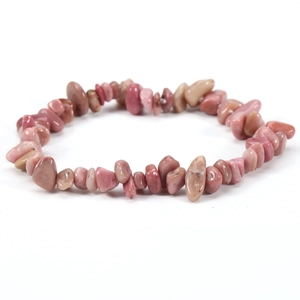 Macro view of pink natural irregular stone beads on a stretchy elastic bracelet