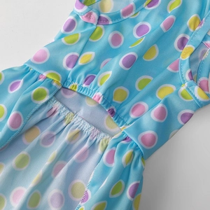 Detail of breathable mesh fabric and waist stitching on this polka dot pet dress