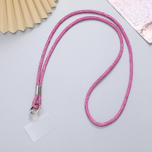 Macro view of rose pink rhinestone phone lanyard with silver metal clasp and connector