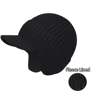 Close-up of black winter knit hat featuring thick fleece lining and warm ear flaps