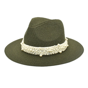 Detailed view of dark olive green straw fedora hat with elegant faux pearl ribbon band