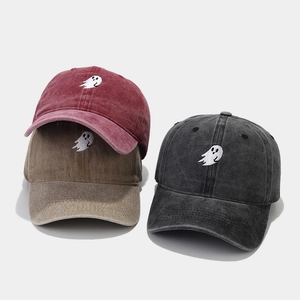 Three vintage washed cotton baseball caps with cute ghost embroidery in red, khaki, and black