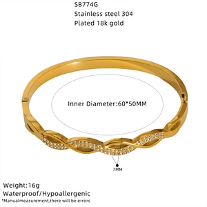 Detail view of 18K gold plated stainless steel cuff bracelet with cubic zirconia inlay