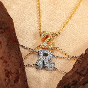 Copper letter pendants Z and R with cubic zirconia pave settings on matching chains