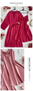 Detailed view of silk-like satin sleepwear set with lace-up robe and slip dress on white fur