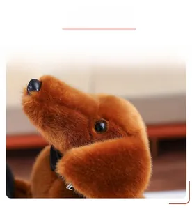 Close-up detail of the plush dog toy showing soft brown fur and realistic black nose