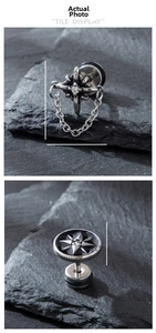 Close-up of vintage stainless steel crown chain earrings and star engraved studs