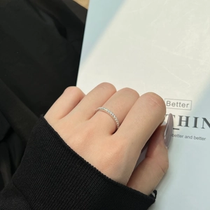 Detailed view of elegant S925 sterling silver eternity band with sparkling pavé diamonds