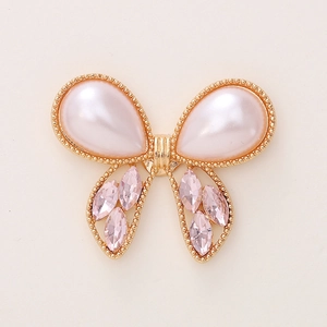 Golden alloy butterfly charm with white pearls and pink crystals for DIY crafts