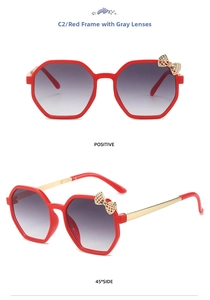Red polygonal kids sunglasses with golden bow detail and double grey lenses