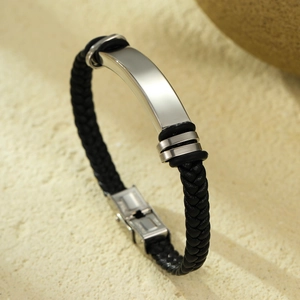 Men's braided leather bracelet with curved stainless steel ID plate and folding clasp