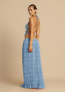 Detail showing light blue pleated backless halter top and matching maxi skirt set