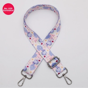 Close-up of No. 639 floral bag strap with gunmetal hooks and adjustable buckle