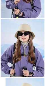 Close-up of windproof khaki bucket hat with professional outdoor hiking gear and mountain view