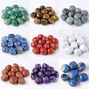 Variety of polished natural crystal stones in nine colors for aromatherapy and decor