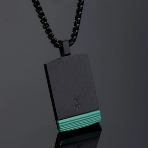 Detailed view of black brushed metal pendant with green malachite inlay and square bead chain