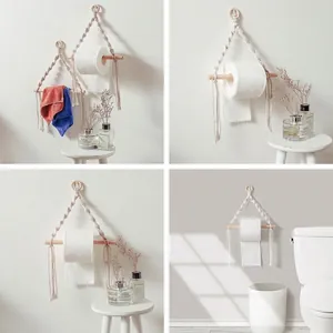 Handmade boho macrame toilet paper holder with natural wood stick and white cotton rope