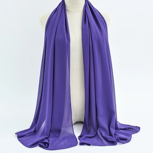 Detail of deep purple long chiffon hijab scarf showing drape and fabric texture on a mannequin