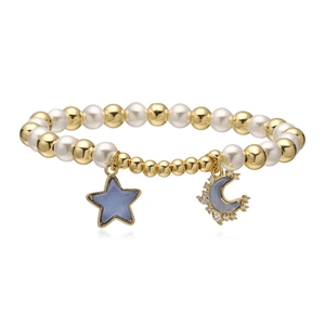 Chic star and moon charm bracelet with gold beads, pearls, and blue sparkling pendants