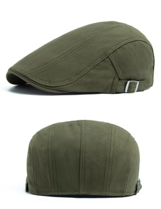 Detail of adjustable silver buckle and olive cotton fabric on vintage flat cap