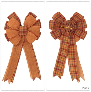 Detailed front and back view of a handmade orange plaid fall harvest decorative bow