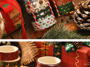 Detailed view of Christmas washi tape with gold foil patterns on warm wooden background