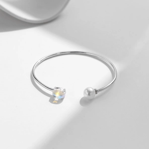Elegant S925 sterling silver open bracelet featuring a round moonstone and white pearl