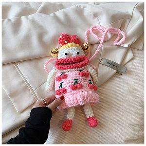 Handmade crochet doll bag featuring pink cherry pattern and pearl strap details