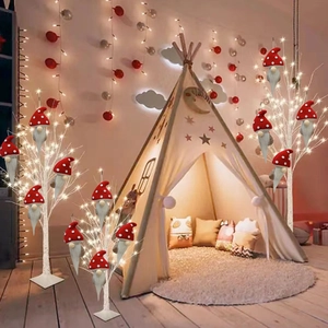 Detailed view of red mushroom Christmas gnomes with white dots hanging on a tree