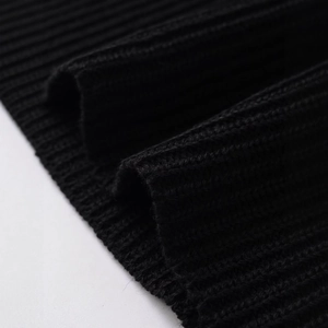 Front view of a stylish black ribbed knit top with a high-quality textured finish