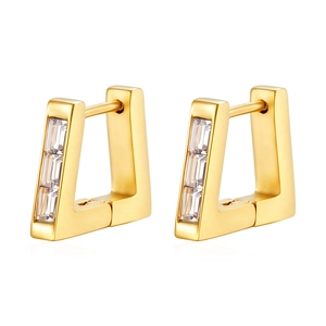 Detailed macro shot of 18K gold triangular hoop earrings with sparkling zircon inlay