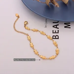Minimalist goldfish charm bracelet in 18k gold plated titanium steel with lobster clasp