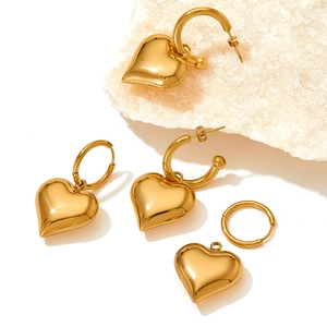 Golden 3D heart drop earrings in polished stainless steel with versatile hoop design