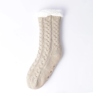 Detail of cable knit slipper socks with thick fleece lining and non-slip sole grip