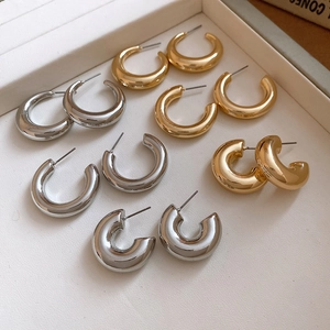 Polished metal C-shaped hoop earrings in gold and silver finish for women fashion
