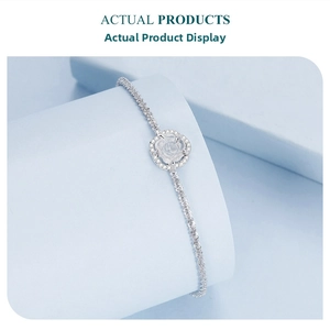 Close-up of S925 sterling silver bracelet featuring a white rose and shimmering crystals