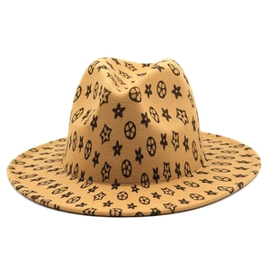 Detailed top view of camel wool fedora hat with black all-over vintage geometric patterns