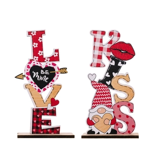 Wooden Valentine's Day table decor featuring LOVE and KISS letters with gnome and hearts