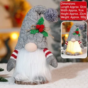 Detailed view of Christmas Rudolf gnome with glowing LED light and grey knitted hat