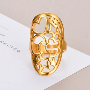 Exaggerated gold stainless steel hollow ring with heart and star patterns shown at 45 degrees